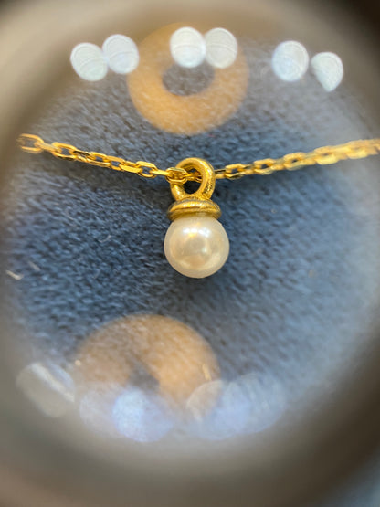 18 karátos arany nyaklánc gyöngyös medállal