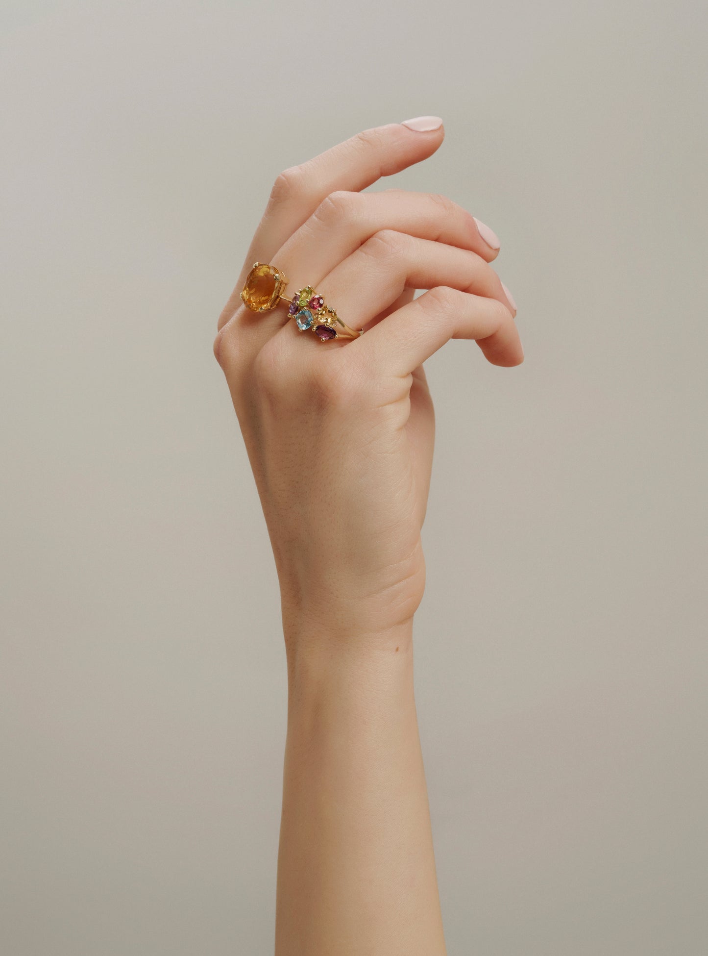 Yellow gold gemstone ring with colored topaz