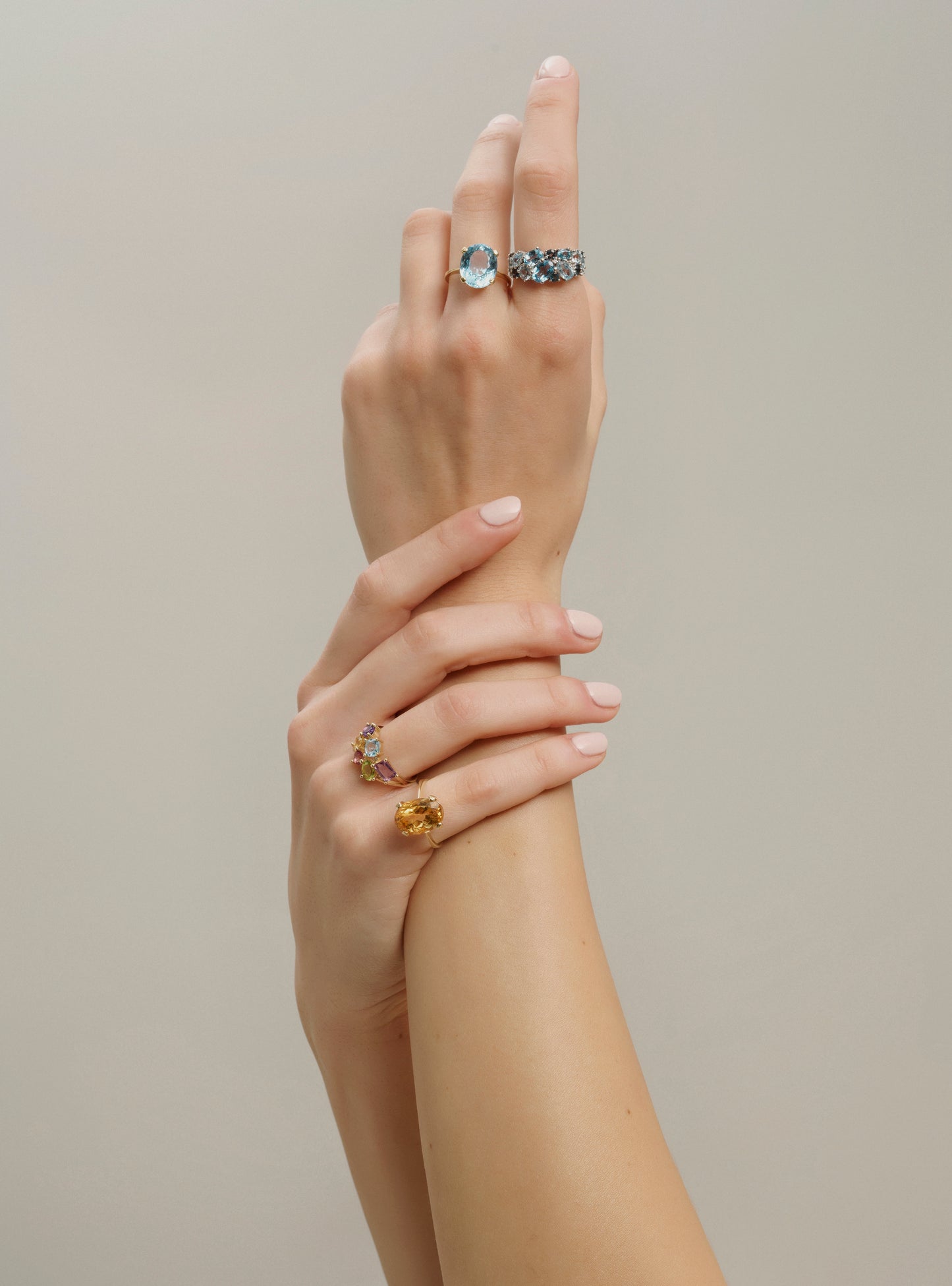 Yellow gold gemstone ring with colored topaz